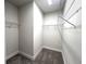 Walk-in closet with carpet floors and wire shelving for optimal storage and organization at 31895 Anchor Point Dr, Wesley Chapel, FL 33545