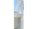 Light-colored exterior with modern windows and architectural details, seen through a screen door at 31895 Anchor Point Dr, Wesley Chapel, FL 33545