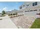 Charming two-story townhome with two-car garage and a well manicured lawn and blue skies at 31895 Anchor Point Dr, Wesley Chapel, FL 33545