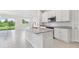 Open concept kitchen with granite countertops, stainless steel appliances and views of the backyard at 31895 Anchor Point Dr, Wesley Chapel, FL 33545