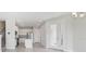 Open concept kitchen with white cabinetry, stainless steel appliances and a center island at 31895 Anchor Point Dr, Wesley Chapel, FL 33545
