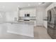 Bright kitchen featuring stainless steel appliances and a large island with granite countertops at 31895 Anchor Point Dr, Wesley Chapel, FL 33545