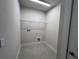 Laundry room with tiled floors and hookups at 31895 Anchor Point Dr, Wesley Chapel, FL 33545