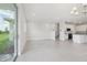 Open concept living area featuring tile floors, stairs to the second floor and an eat-in kitchen at 31895 Anchor Point Dr, Wesley Chapel, FL 33545