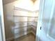 Spacious walk-in closet with metal shelving for optimal organization and storage at 31895 Anchor Point Dr, Wesley Chapel, FL 33545