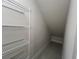View of attic space with wire shelving and sloped ceiling at 31901 Anchor Point Dr, Wesley Chapel, FL 33545