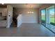 Dining room area with tile flooring and sliding glass doors to the patio at 31901 Anchor Point Dr, Wesley Chapel, FL 33545