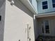Home exterior featuring stucco siding and a glass paneled front door at 31901 Anchor Point Dr, Wesley Chapel, FL 33545