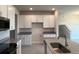 New kitchen featuring white cabinets, granite counters, and stainless steel appliances at 31901 Anchor Point Dr, Wesley Chapel, FL 33545