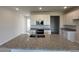 Bright kitchen featuring granite countertops, stainless appliances, and a center island at 31901 Anchor Point Dr, Wesley Chapel, FL 33545