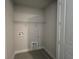 Functional laundry room equipped with washer/dryer hookups and convenient shelving at 31901 Anchor Point Dr, Wesley Chapel, FL 33545