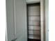 View of a walk-in pantry featuring wire shelving and gray tiled floor at 31901 Anchor Point Dr, Wesley Chapel, FL 33545