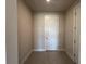 This spacious room features tiled floors, neutral paint, and a white door for added appeal at 31901 Anchor Point Dr, Wesley Chapel, FL 33545