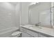 Modern bathroom featuring a tiled backsplash, ample counter space, and a bathtub at 6741 Michael Favor Way, Wesley Chapel, FL 33545