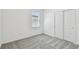 Bedroom featuring a neutral color palette, plush carpeting, and a closet at 6741 Michael Favor Way, Wesley Chapel, FL 33545