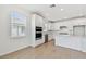 Modern kitchen with stainless steel appliances, white cabinetry, and a well lit space at 6741 Michael Favor Way, Wesley Chapel, FL 33545
