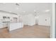Open living area combining a modern kitchen with bright, airy spaces at 6741 Michael Favor Way, Wesley Chapel, FL 33545