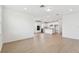 Open-concept living space featuring a modern kitchen and bright, airy living area at 6741 Michael Favor Way, Wesley Chapel, FL 33545