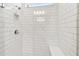 Modern shower with sleek tilework, recessed lighting, and built-in shower niche at 6741 Michael Favor Way, Wesley Chapel, FL 33545