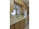 View of kitchen with white appliances and wood cabinets at 4460 95Th N Ave # 1, Pinellas Park, FL 33782