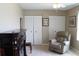 Relaxing bedroom with a recliner, built-in shelving and large closets at 4460 95Th N Ave # 1, Pinellas Park, FL 33782