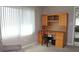 Bright home office features built-in desk and cabinet at 4460 95Th N Ave # 1, Pinellas Park, FL 33782