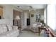 Sunlit living room featuring comfortable seating and decorative accents at 4460 95Th N Ave # 1, Pinellas Park, FL 33782