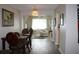 Open dining area with hardwood floors and view of living room and kitchen at 4460 95Th N Ave # 1, Pinellas Park, FL 33782
