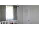 Bedroom with a white closet and gray curtains at 4460 95Th N Ave # 1, Pinellas Park, FL 33782