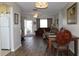 Open concept dining room with hardwood flooring and a view of the living room at 4460 95Th N Ave # 1, Pinellas Park, FL 33782