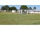 Community shuffleboard courts with covered seating areas at 4460 95Th N Ave # 1, Pinellas Park, FL 33782