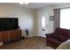 Living room with hardwood floors, comfy seating and access to patio at 4460 95Th N Ave # 1, Pinellas Park, FL 33782