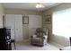 Relaxing bedroom with a recliner, built-in shelving and large closets at 4460 95Th N Ave # 1, Pinellas Park, FL 33782