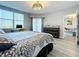 Spacious main bedroom with large bed, dresser and access to balcony at 6495 Shoreline Dr # 8502, St Petersburg, FL 33708