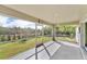 Screened porch with tile flooring and view of backyard at 2857 Brewster Rd, North Port, FL 34288