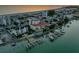 Aerial view of waterfront property with private docks and beach access at 10133 Gulf Blvd # E3, Treasure Island, FL 33706