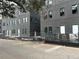 Dark gray brick townhomes under construction, modern design at 1218 E Kay St # 3, Tampa, FL 33602