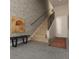 Modern entryway with wood staircase and accent wall at 1302 E Kay St # 1, Tampa, FL 33602
