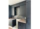 Dark kitchen with dark cabinetry and marble countertops at 1302 E Kay St # 1, Tampa, FL 33602