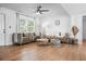 Light-filled living room with hardwood floors and comfortable furniture at 7110 39Th N Ave, St Petersburg, FL 33709