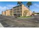 Two-story condo building with ample parking and lush landscaping at 12760 Indian Rocks Rd # 1071, Largo, FL 33774