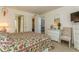 Bedroom with dresser, chair and king-size bed at 12760 Indian Rocks Rd # 1071, Largo, FL 33774