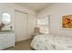 Cozy bedroom with a twin bed, white wicker dresser, and window at 12760 Indian Rocks Rd # 1071, Largo, FL 33774