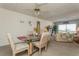 Dining area with glass table and chairs, view into living room at 12760 Indian Rocks Rd # 1071, Largo, FL 33774