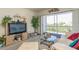 Bright living room with balcony access and comfortable seating at 12760 Indian Rocks Rd # 1071, Largo, FL 33774