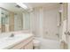 Clean bathroom with a tub shower combo and a vanity with sink at 12760 Indian Rocks Rd # 1071, Largo, FL 33774