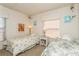 Two twin beds, nightstands, and window with blinds in a well-lit bedroom at 12760 Indian Rocks Rd # 1071, Largo, FL 33774