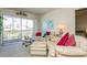 Living room features a sofa, coffee table, and access to a balcony at 12760 Indian Rocks Rd # 1071, Largo, FL 33774