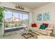 Relaxing living room with a beige sofa and sliding glass doors leading to a balcony at 12760 Indian Rocks Rd # 1071, Largo, FL 33774