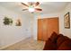 Bedroom with double doors to closet and ceiling fan at 10931 Clara Ln, St Petersburg, FL 33708